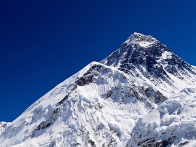 The summit of Everest with a dark blue sky