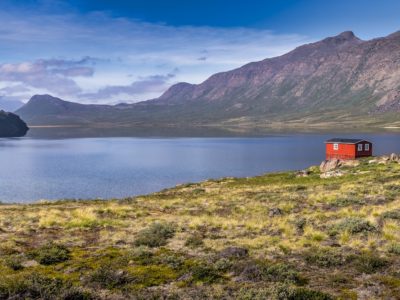 trekking the arctic circle trail lead image with hut and lake