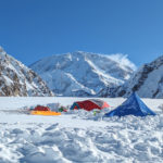 Denali behind tents at base camp