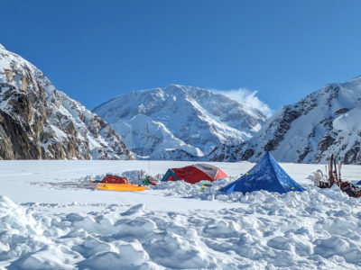 Denali behind tents at base camp